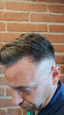 Barber-style men's clipper cut.