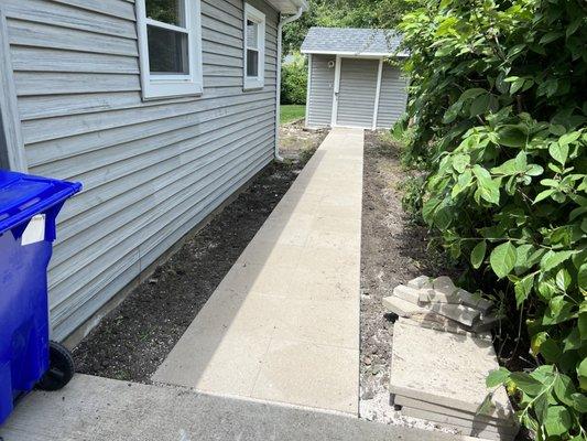 A paver walkway. 
Perfect for when it rains. 
No need to walk in the mud!