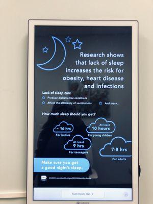 In examination room screen posters for patient information and advertising