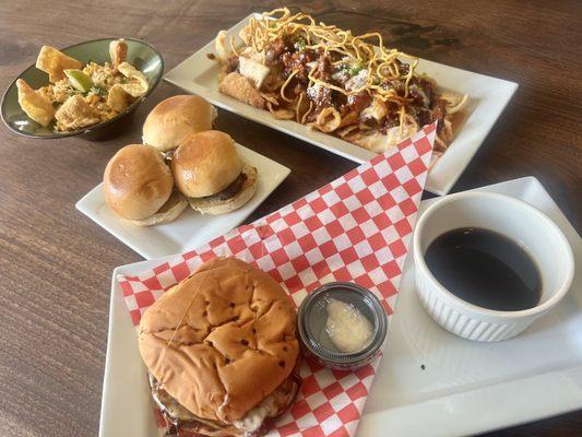 Elote, wagyu sliders, wonton nachos, steak sandwich