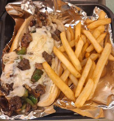 Cheesesteak hoagie with fries