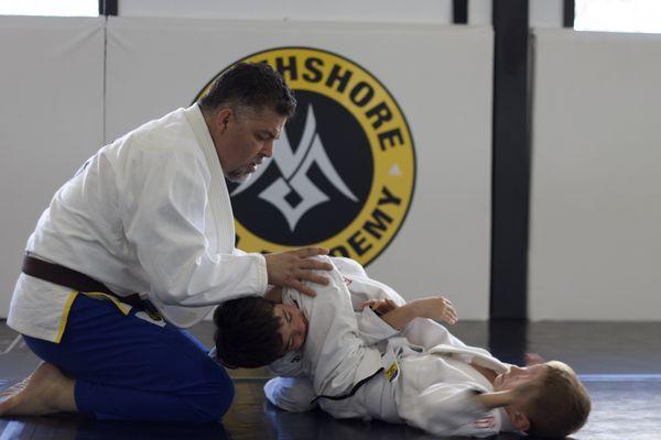 Coach Joe instructing students in our kids martial arts class.