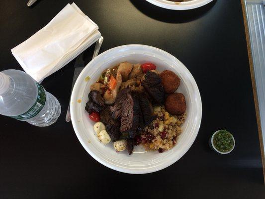 Burn churrasco with sesame chicken, antipasto salad, quinoa with mango and cranberry, and rice cheese ball.