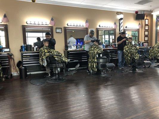 Barbers doing what they do best!