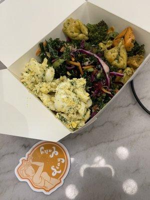 A colorful salad trio to-go with the delightful egg salad, slaw crunch, and cheese tortellini. Also check the stay salty sticker.