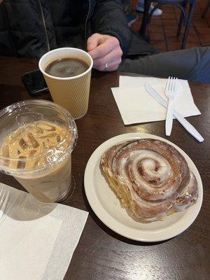 Cinnamon roll, iced latte, and an americano