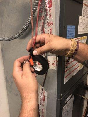 Taping up some exposed electrical from someone else's work