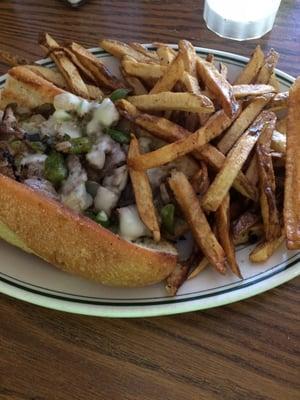 The Philly Cheese Steak with a side of fries.