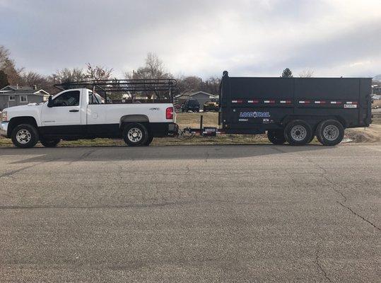 Truck and 14' dump trailer we use for the service.