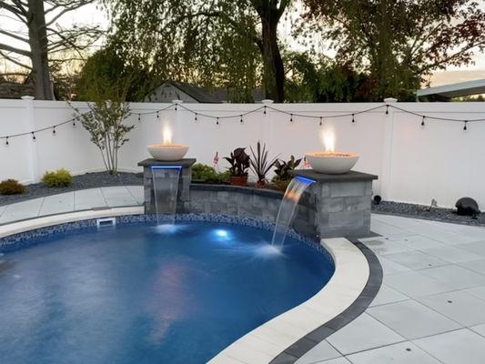 Pool Patio using Techo-Bloc Para Smooth HD. Features included Waterfalls with Firebowls and a Firepit seating area - Deer Park, NY 11729