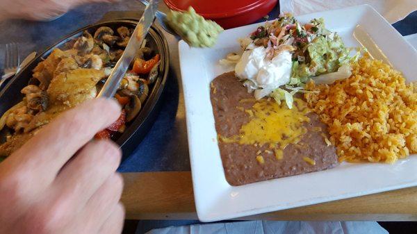 Snapper & shrimp fajitas, portions so big they use 2 plates.