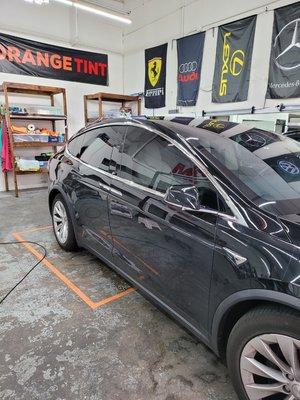 Tinted Tesla X all windows and sunroof and front windshield.