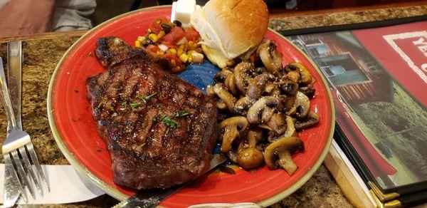 Ribeye Steak Entree with mushrooms substituted.