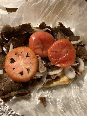 Two wrinkled butt ends of tomato