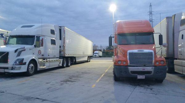 Large cement truck parking lot.