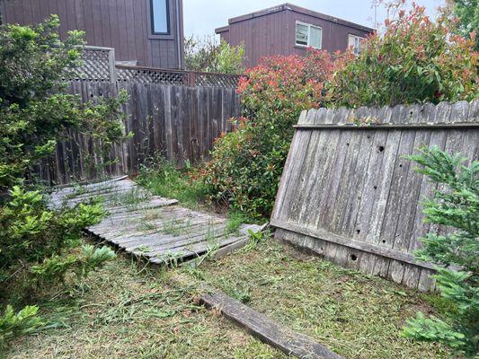 This fence has been blown down for months.