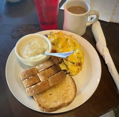 The signature Fat Spoon Omelet, with grits and wheat toast.