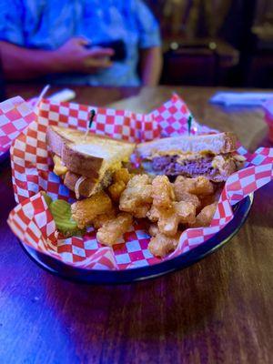 Patty Melt on sourdough with American Cheese & tots.