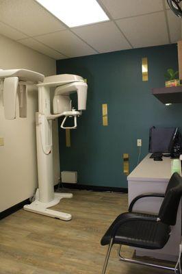 Our panoramic and cephalometric X-ray machines rotate around your head to capture images and provide our team with high-definition images.