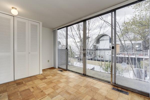 Balcony off back bedroom in this 3BR 2.5 BA town-home at River Park in SW DC 20024.