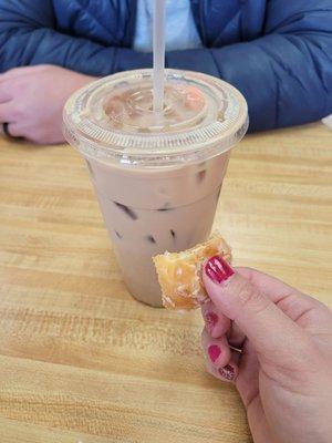 Iced coffee (med) and half of the donut hole