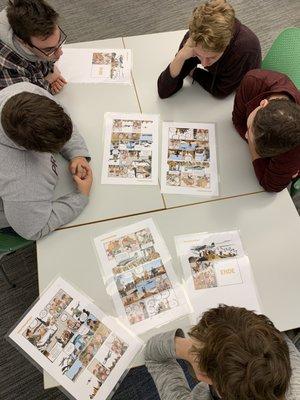 German students working on comic worksheets during a visit at the Goethe-Institut.