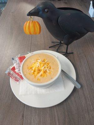 Our friendly winged server is showcasing one of our freshly homemade soups weekly.  Pictured is a cup of Spicy Chicken Chili.