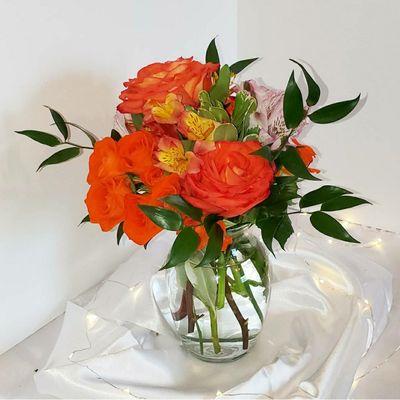 Florists choice with orange roses   for a sunset look