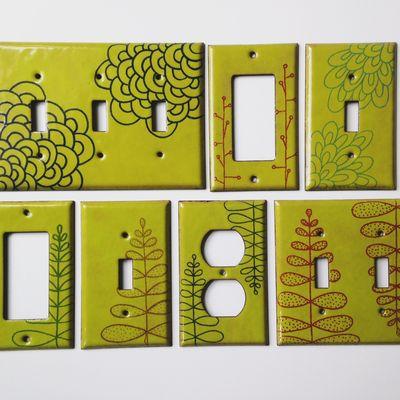 A suite of sweet light switch plates. Hand drawn. Glass on stamped copper.