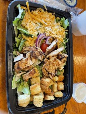 Chicken salad. Old cold chicken.  Half croutons. Half as much food as a Wendy's salad. $7.99.