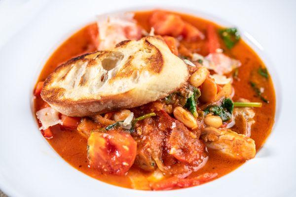 Moms Italian Chicken: Braised Chicken Thighs, Tomato Parmesan Brodo, Fennel, Peppers, Creamy Polenta, Grilled Sourdough