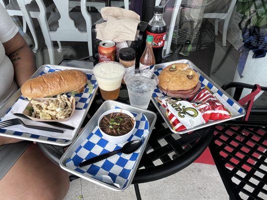 Our spread. Shrimp, Poboy, chicken, gumbo, and muffaletta.