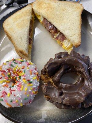 Bacon egg & cheese sandwich on white, donuts