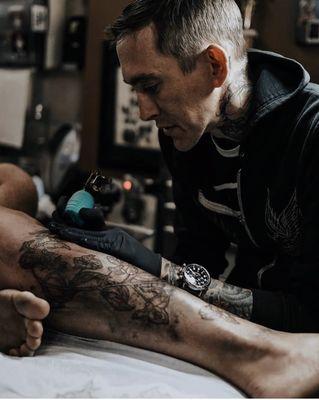 Cody working in a botanic leg piece