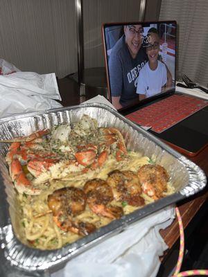 Dungeness crab & shrimp over garlic noodles
 Holla to go