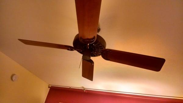 The ceiling fan with two blades vlowing up, the other two down.