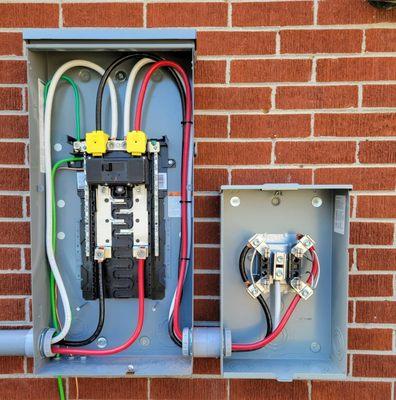 New Meterbase and exterior "Feed-Thru" Panelboard installed at a home in Hampton, VA