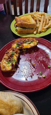 Potato skins on the red plate, bologna sandwich, and fries at the top.