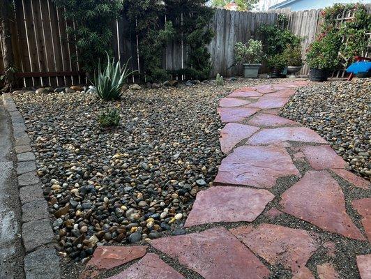 Flagstone path through zeroscaped landscaping