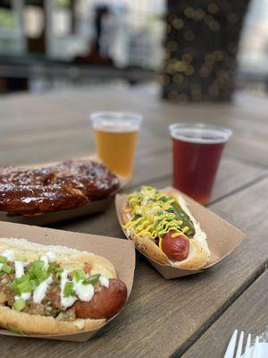 Chicago style dog, Doner sausage, a pub pretzel, and two draft beers