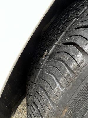 Damage to tire that they fixed at no cost.