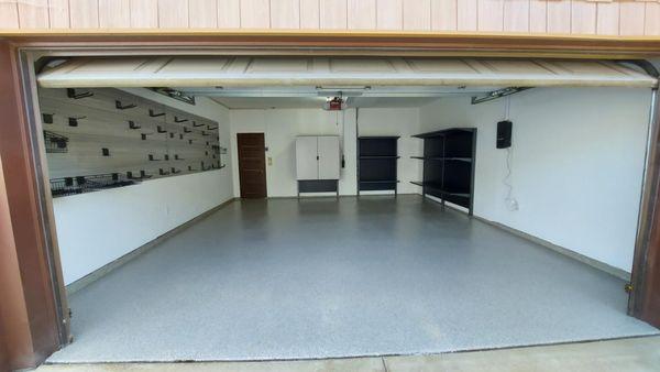 Full makeover in Apple Valley with Slatwall, cabinets and shelving.  Beautiful HG Polyaspartic floor coating and a Insta Vac system!