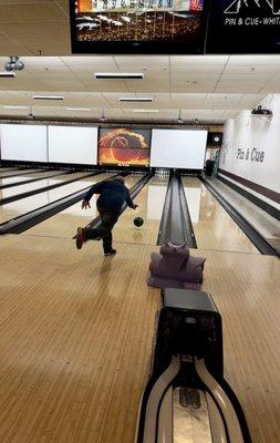 My husband bowling.