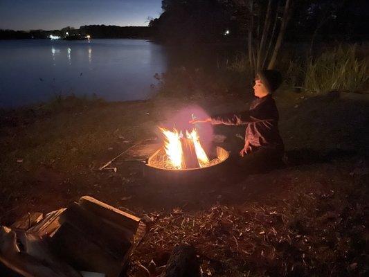 Enjoying the camp fire by the lake.