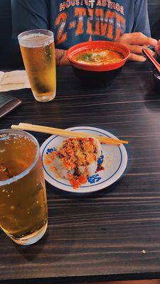 Beer, sushi, spicy noodle soup