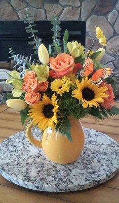 Send sunshine with bright roses and sunflowers