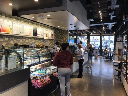 Interior is new with concrete flooring. Overlooking street view on Olympic Blvd on one side