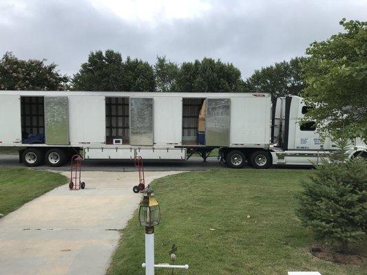 Huge delivery truck and items packed tightly inside.