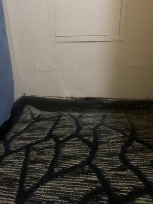 The area where you can hang cloths has a hole in the bottom where the carpet is.