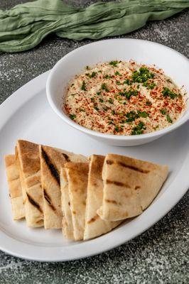 Grill Eggplant mixed with Tahini, Olive Oil and, Crushed Garlic, and Salt. Served with Two Freshly Daily Homemade Pita Bread